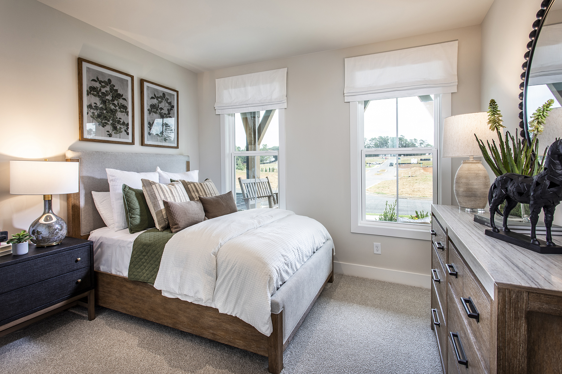 bedroom with windows and carpets