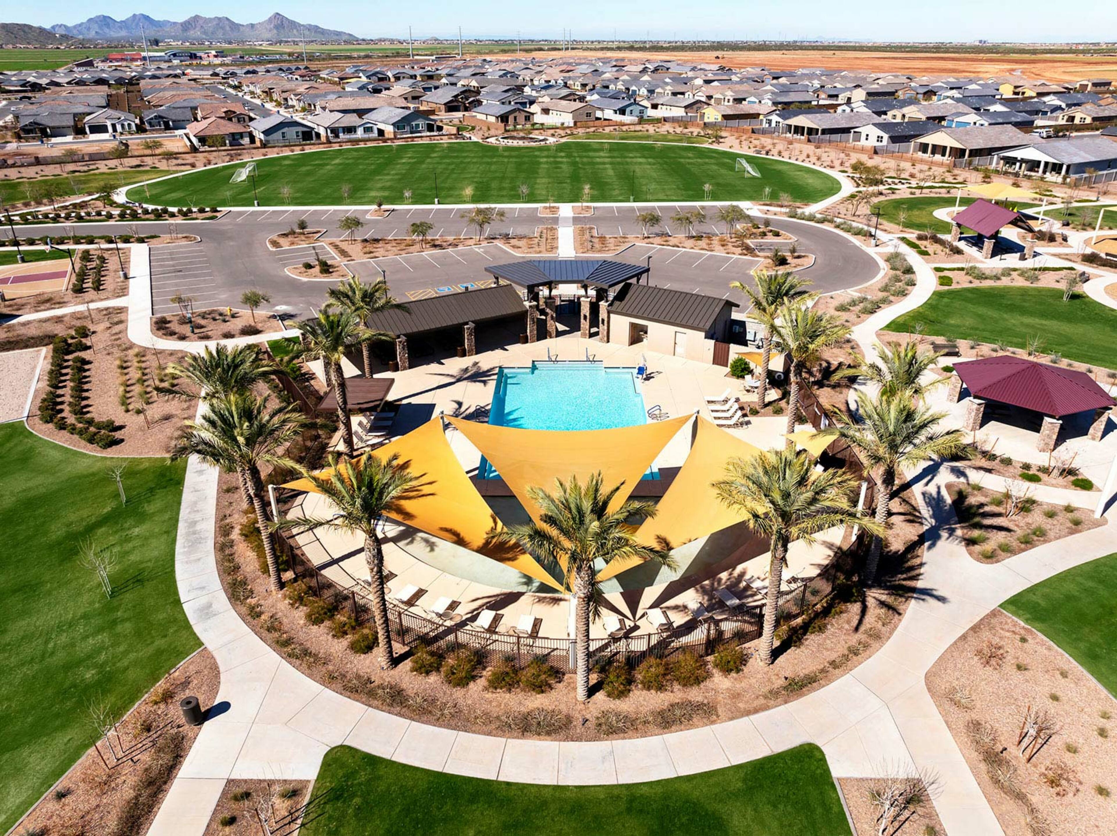 community resort-style pool with sunshades