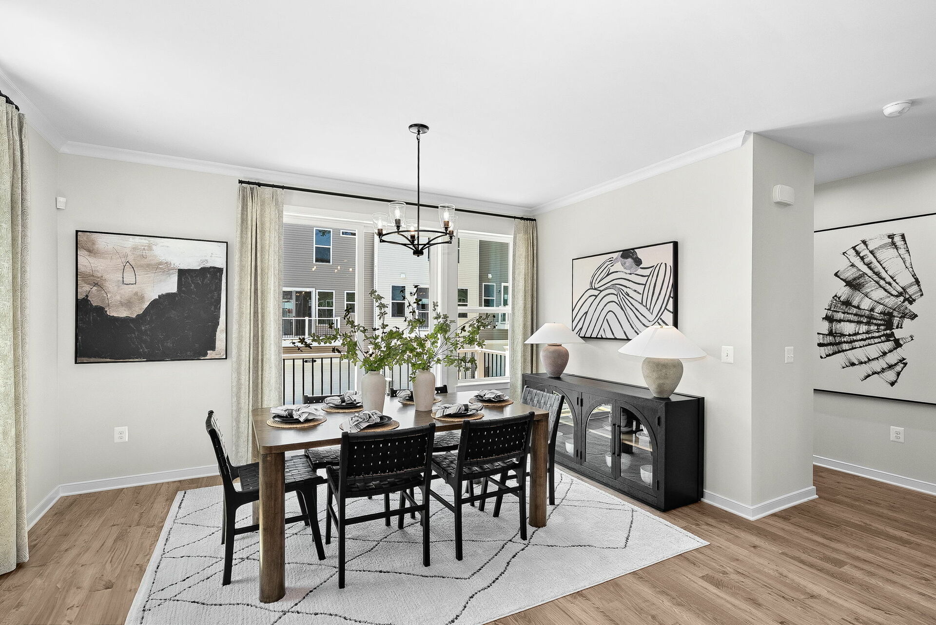 dining table with chairs and carpet and hardwood floors underneath, entrance to deck
