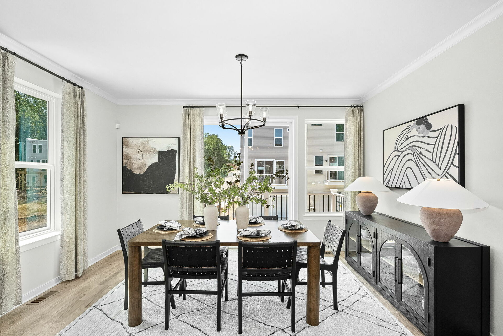 dining table with carpet and hardwood floors underneath, windows to deck