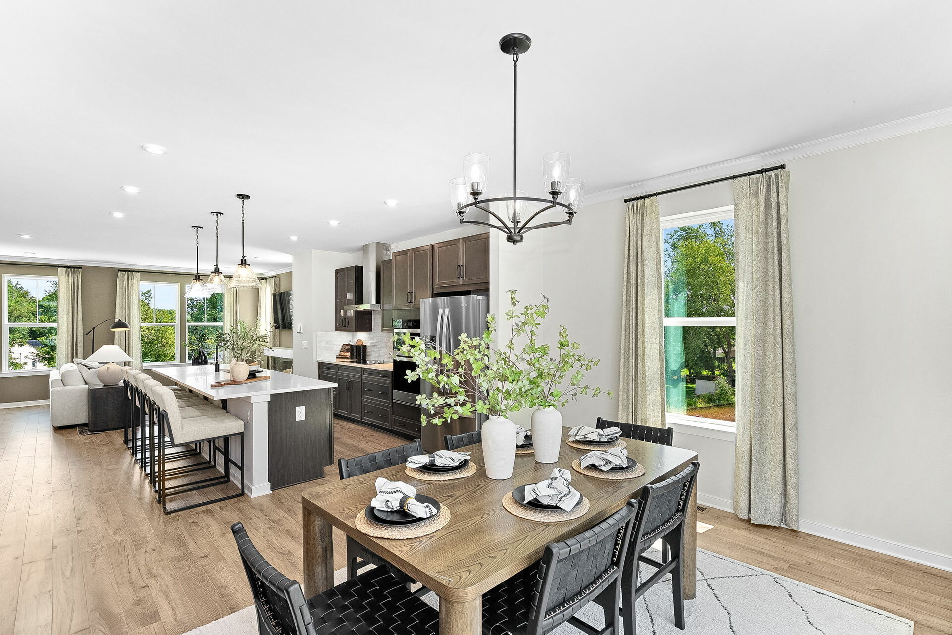 dining table with 5 chairs and view of kitchen
