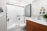 bathroom with neutral floors and white countertops
