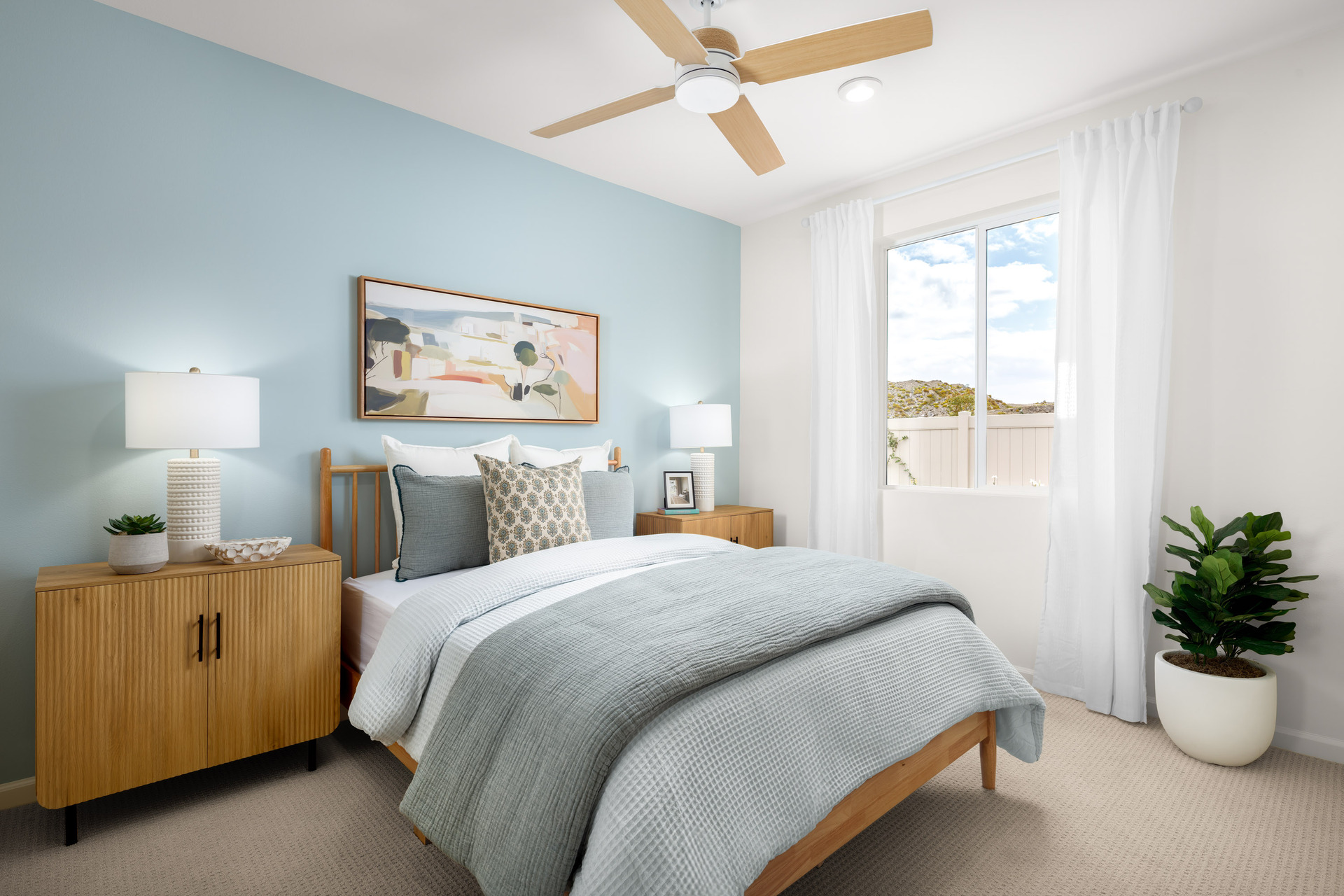 bedroom with neutral floors and large window
