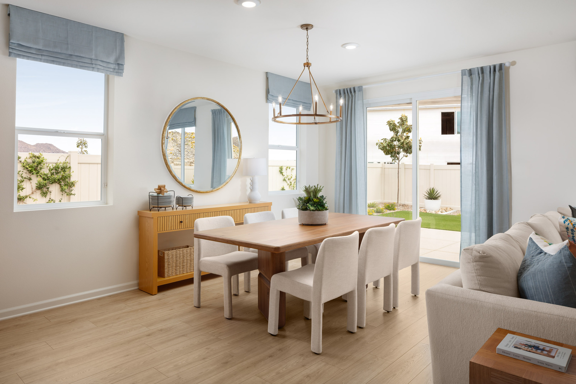 dining area with neutral floors and large window