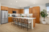 Kitchen with neutral cabinets and white countertops