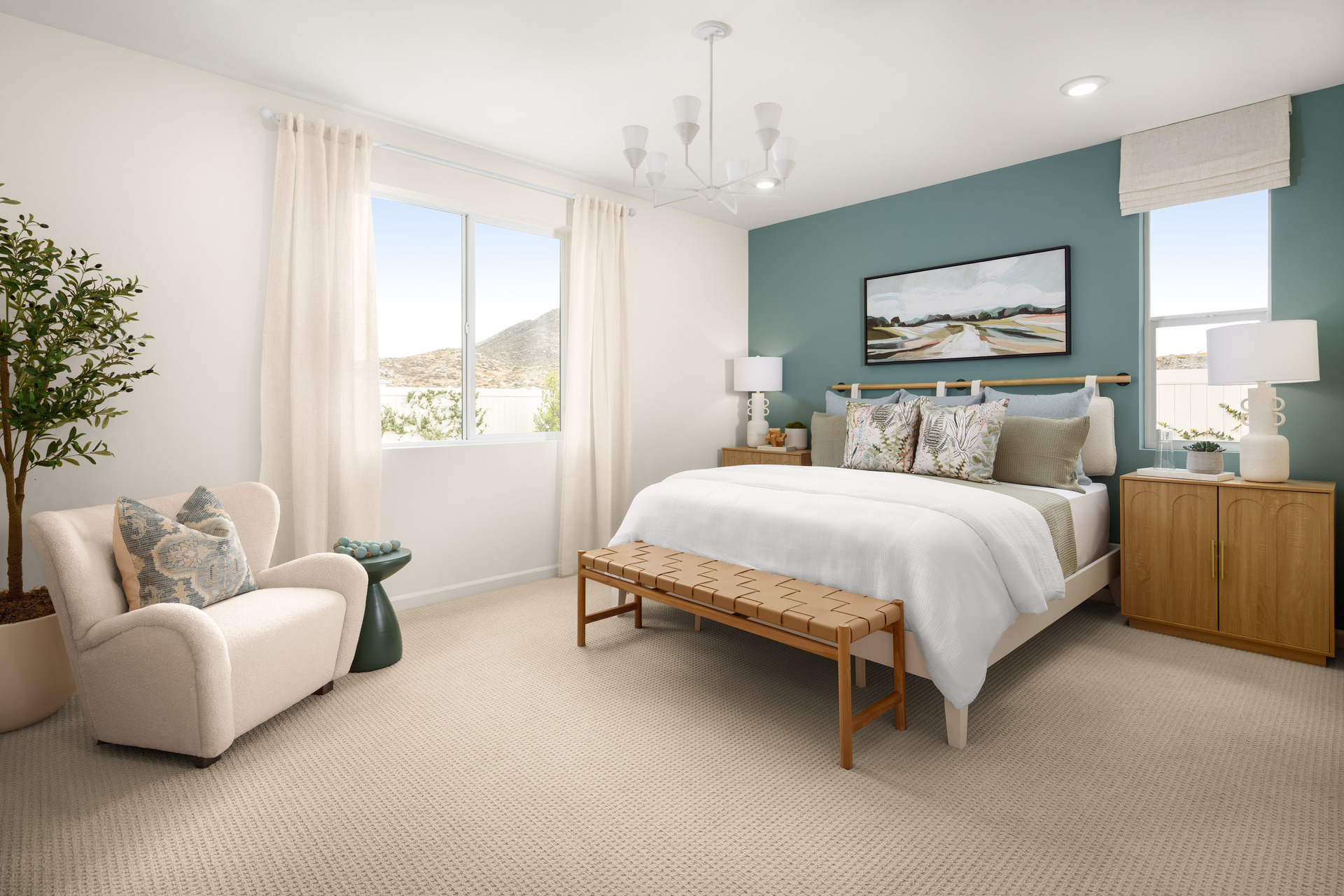 primary bedroom with neutral carpet and large windows