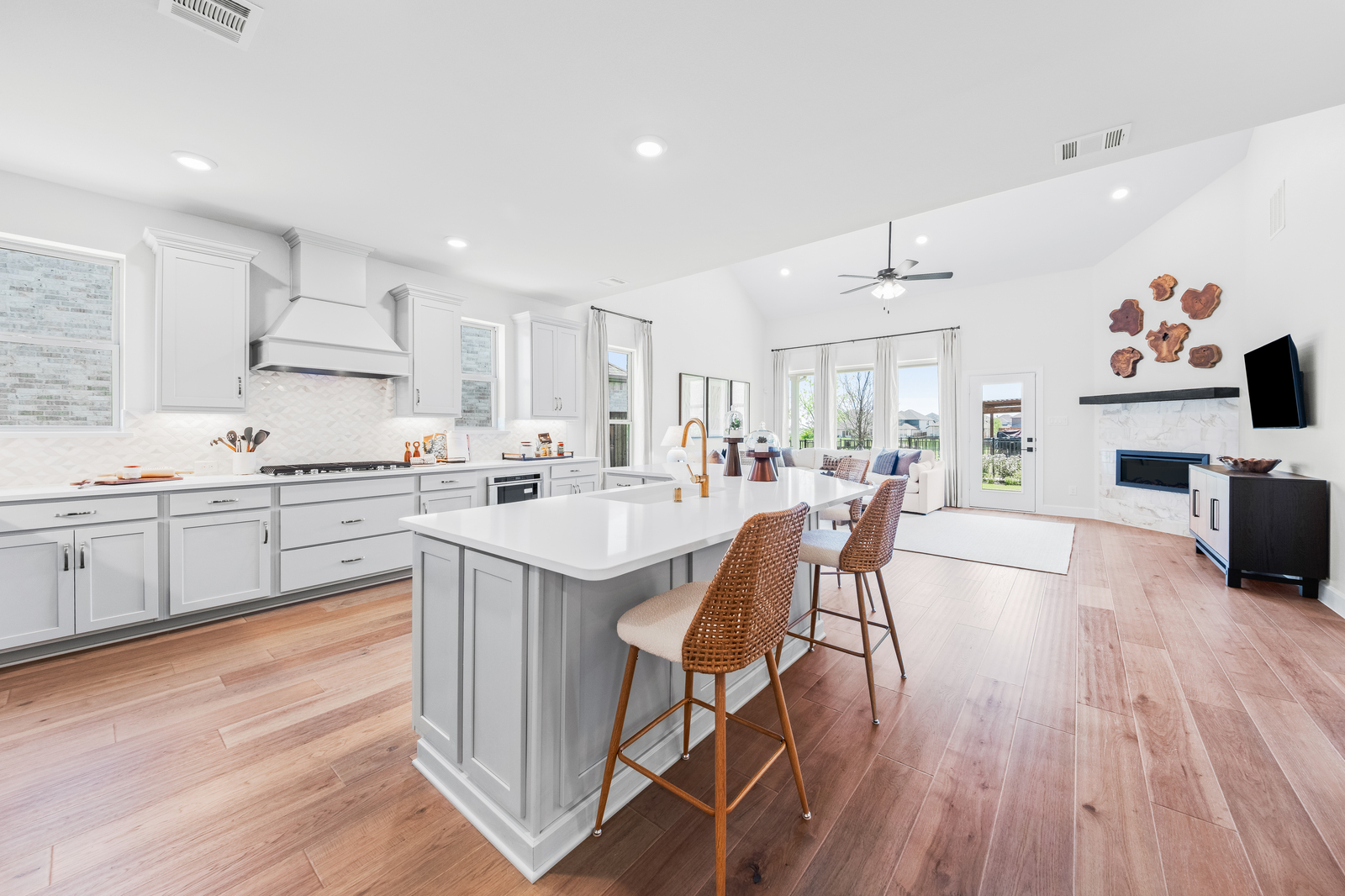 open kitchen with large island and wood floors