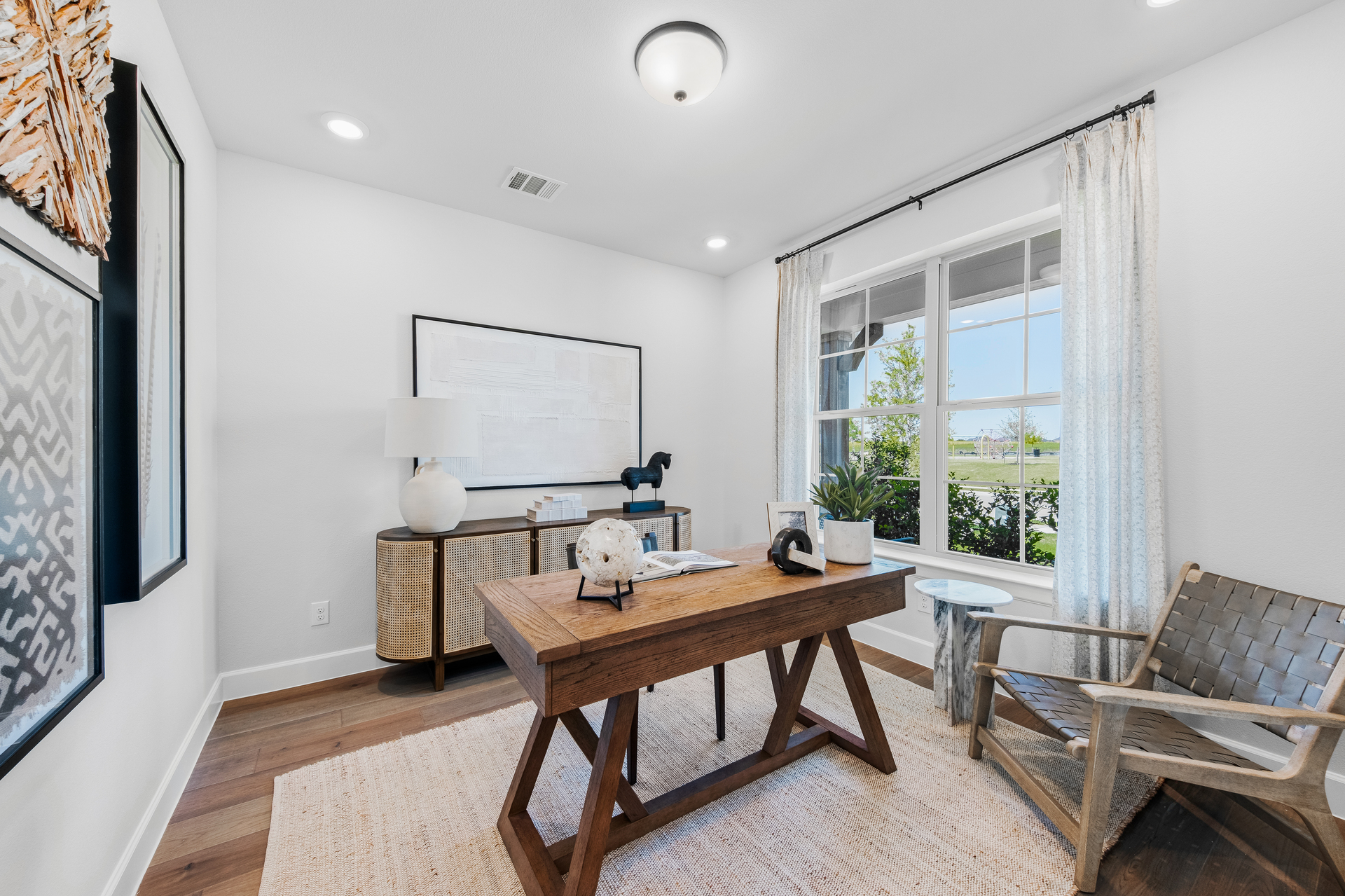 spacious study with hardwood flooring and windows