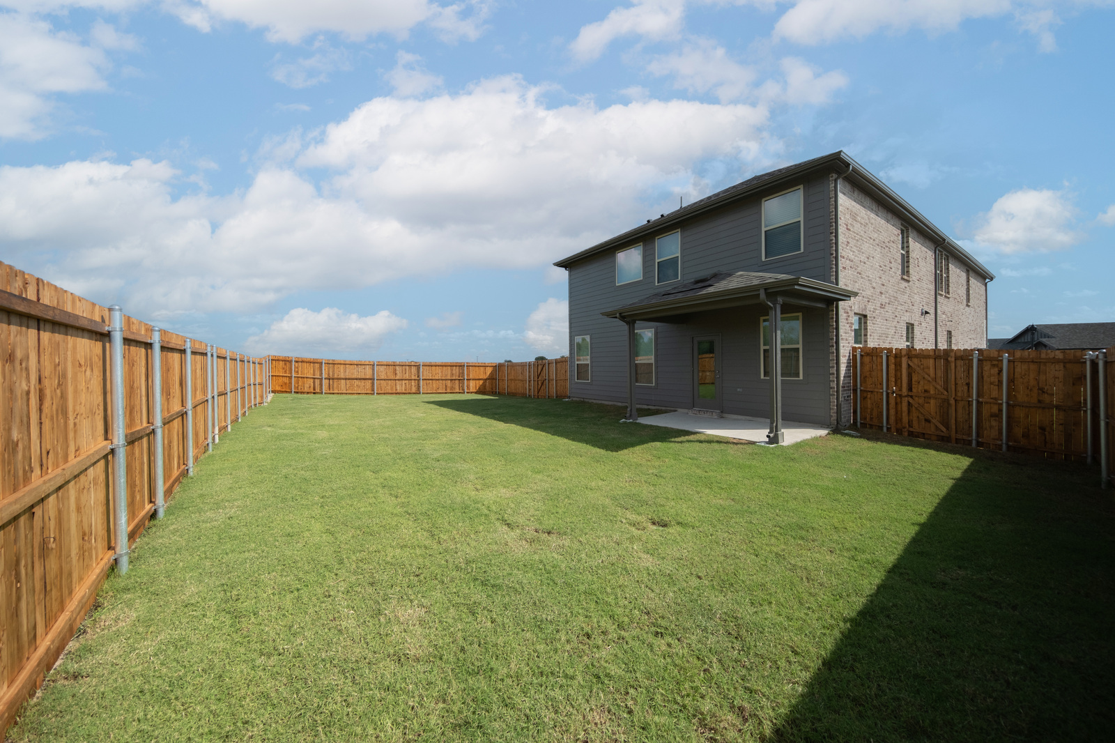 backyard of home with covered patio