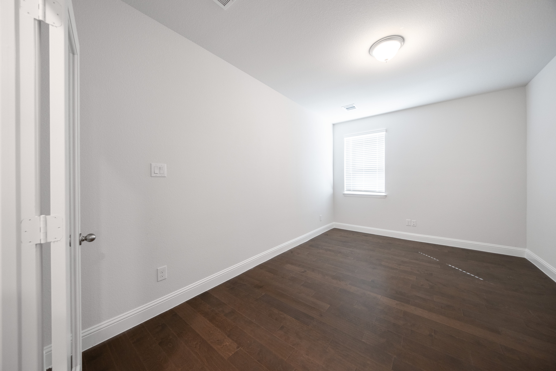 private study with hardwood flooring