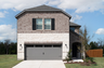 exterior of home with brown brick and white stone