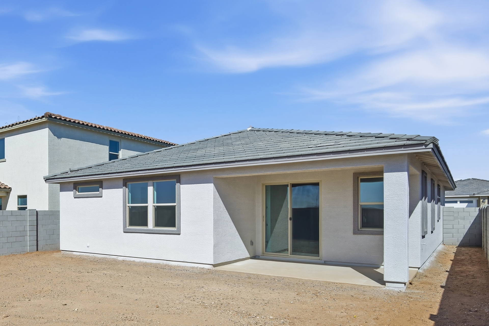 spacious backyard and view of the covered patio