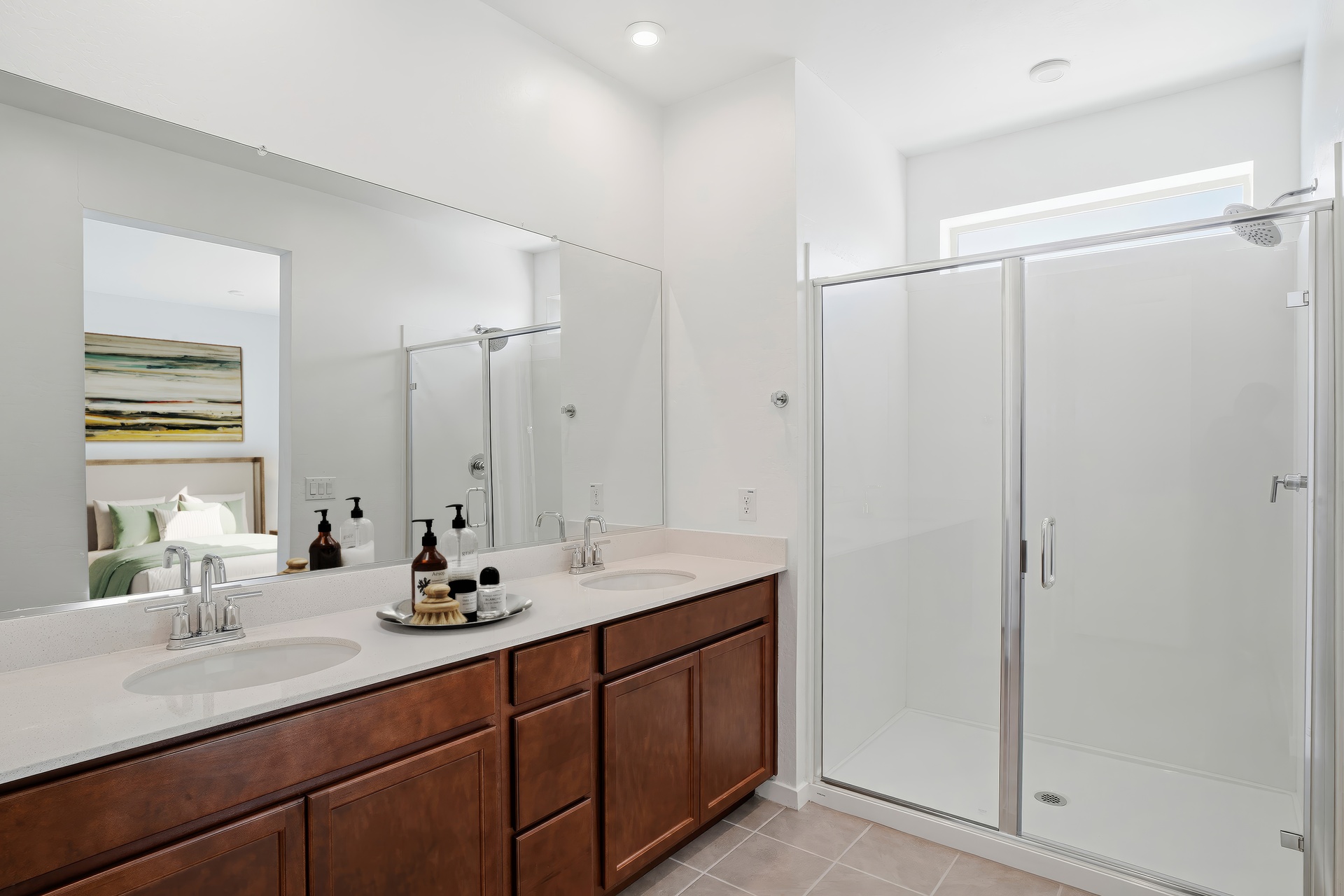 large bathroom with brown cabinets and a large walk-in shower