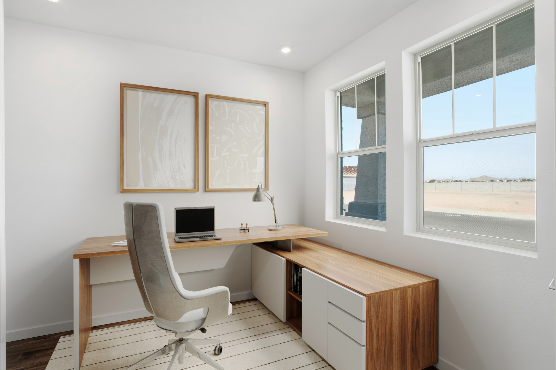 home office setup with wooden desk and white accents