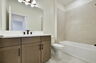 single-sink vanity, water closet and shower