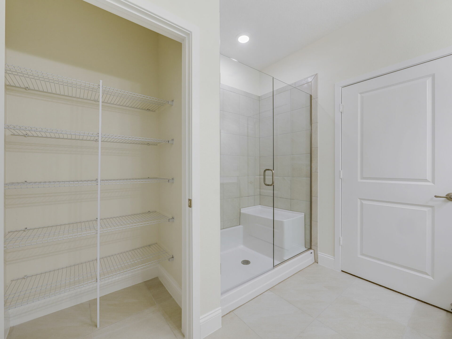 dual sink vanity, closet and shower