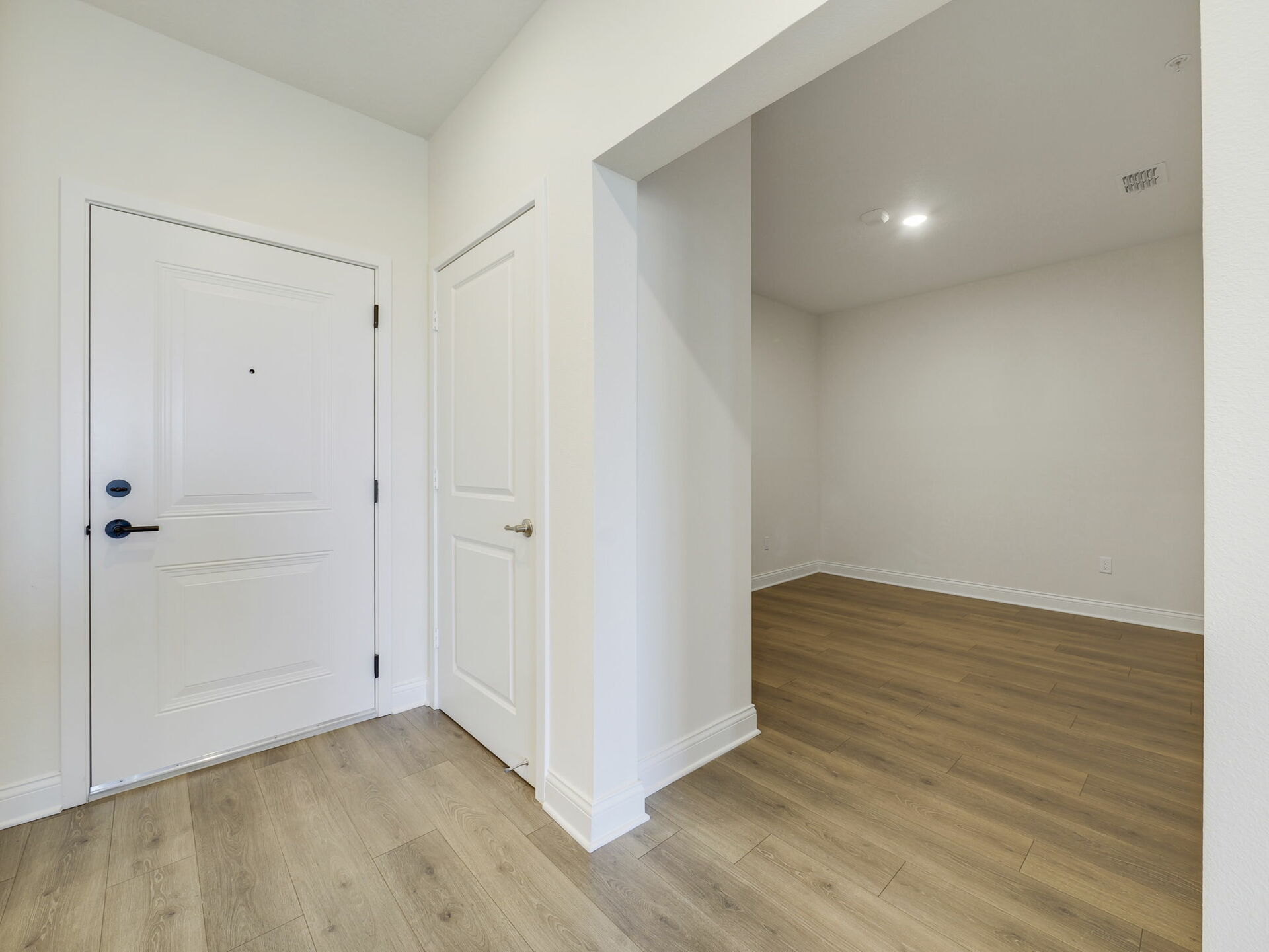 room with access to kitchen and great room