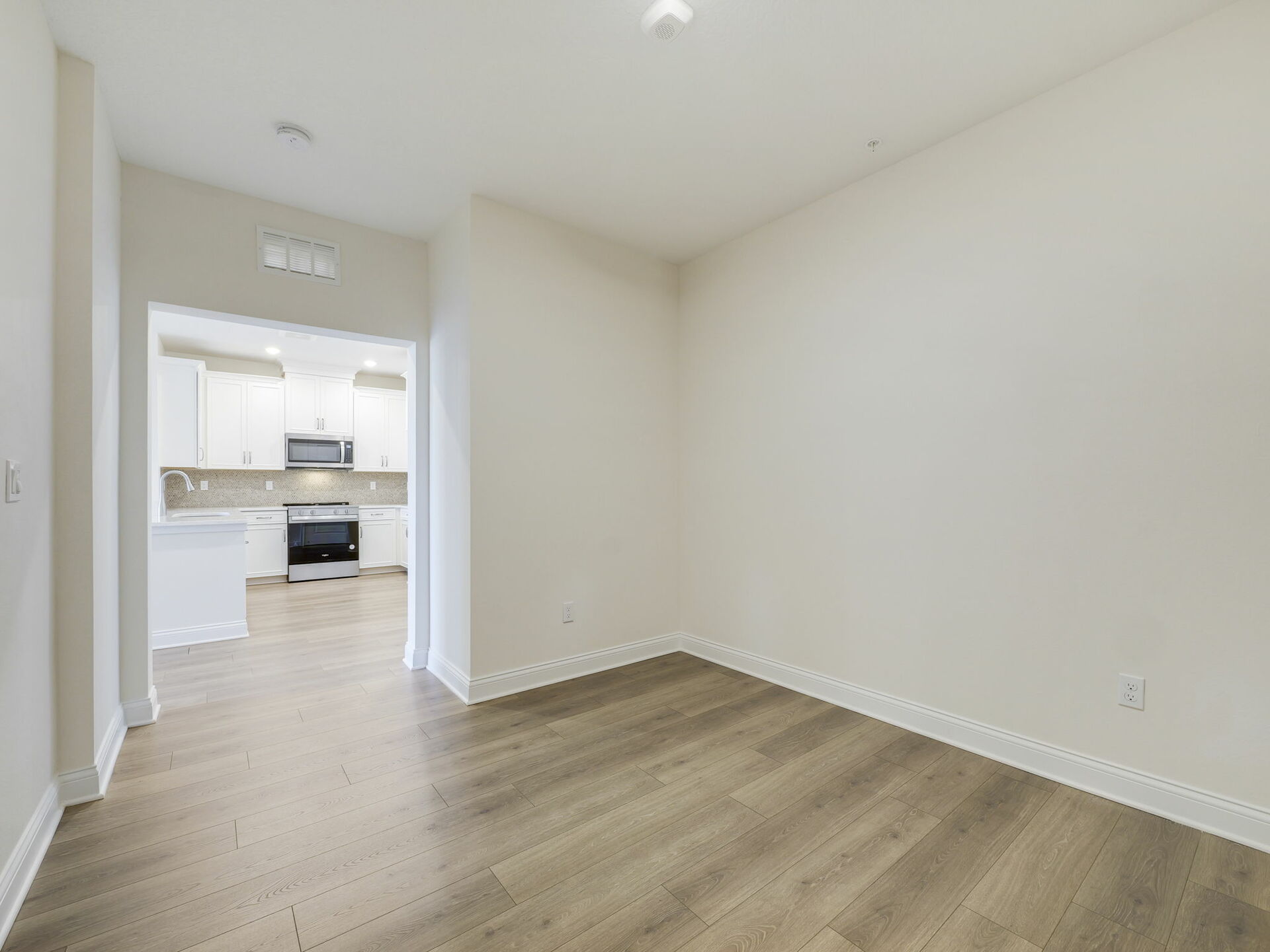 room with access to kitchen and great room