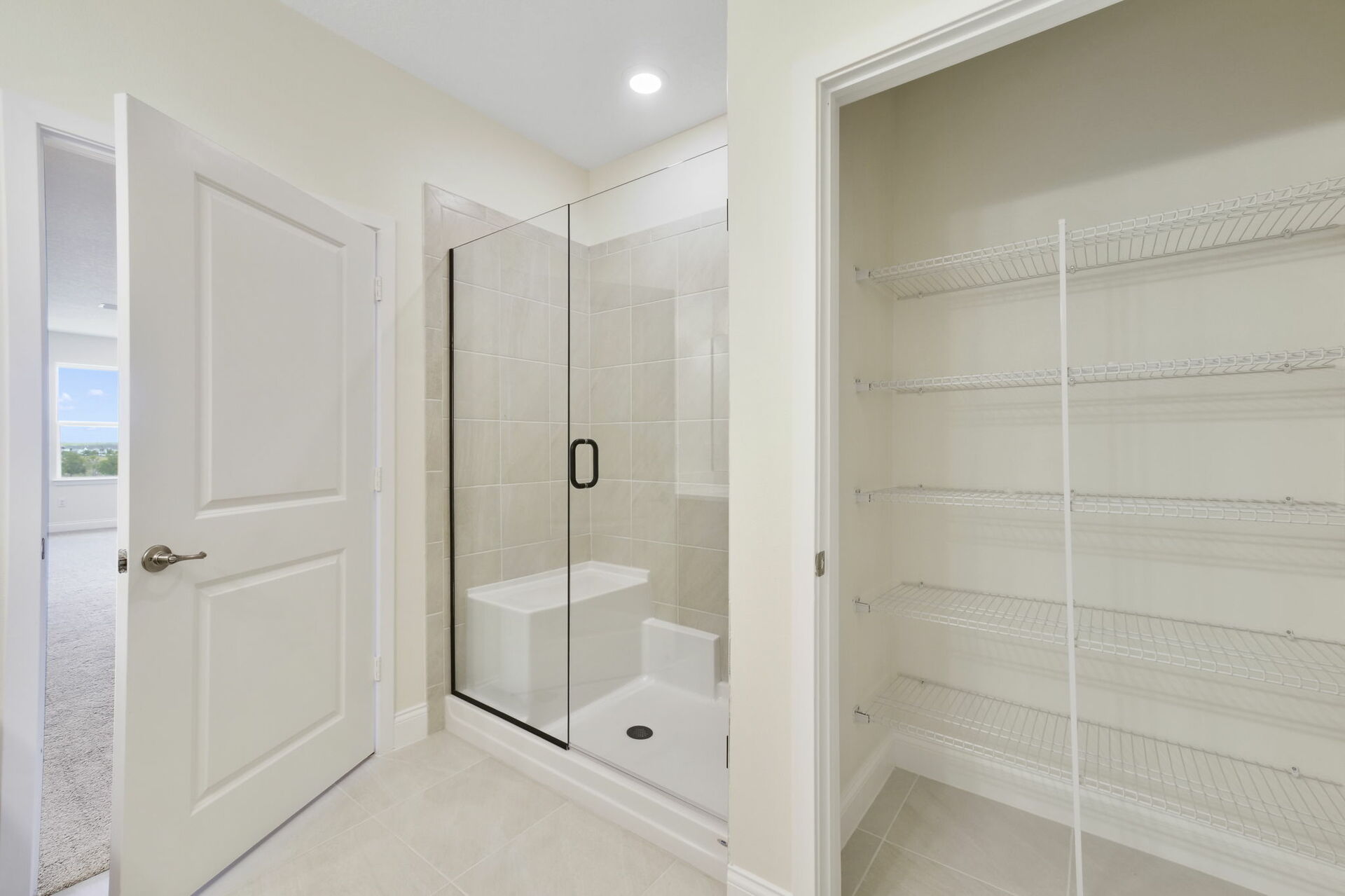 dual sink vanity with large mirror, water closet, shower and linen closet