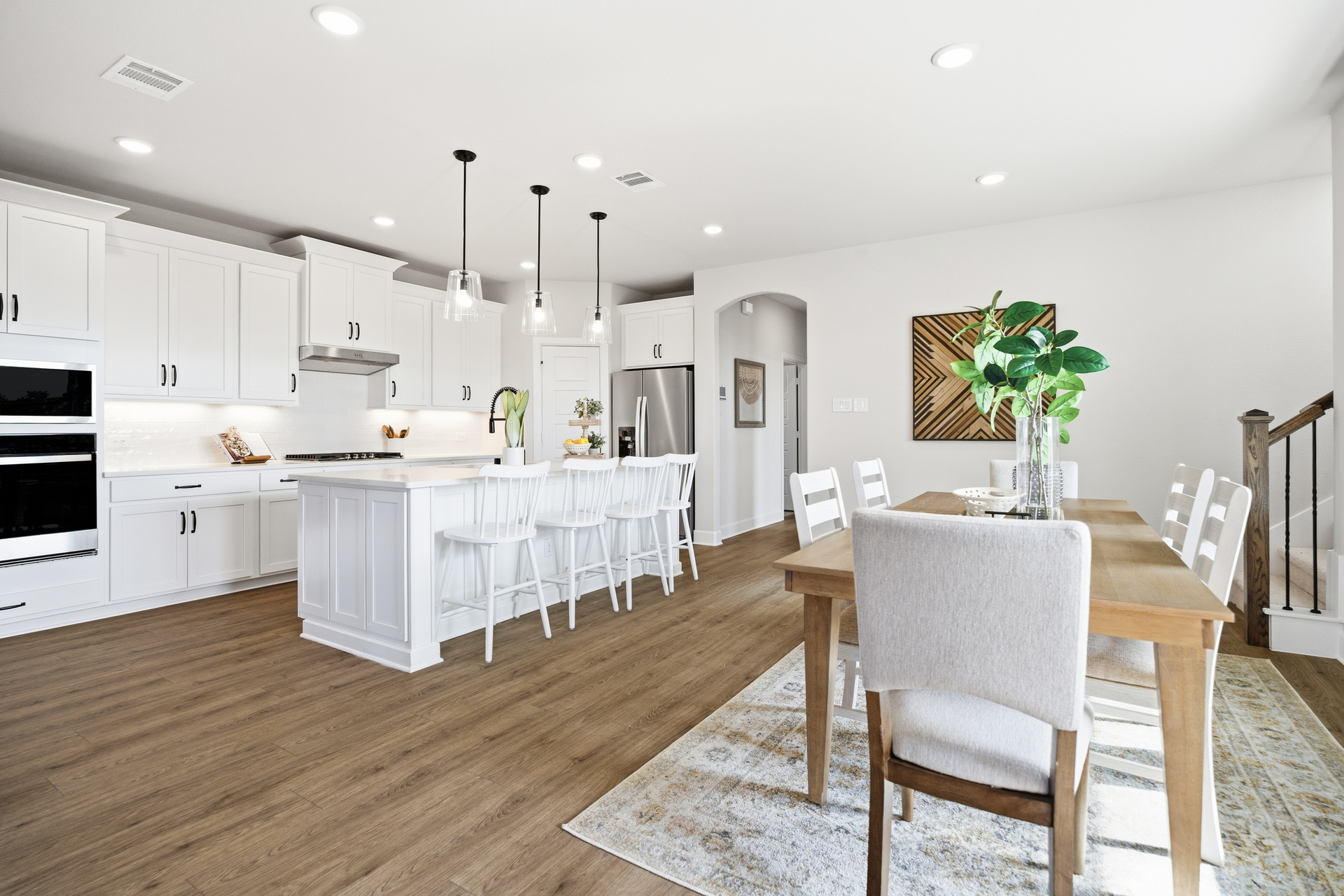 open kitchen and dining area with hardwood flooring