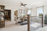 open loft with carpet and windows