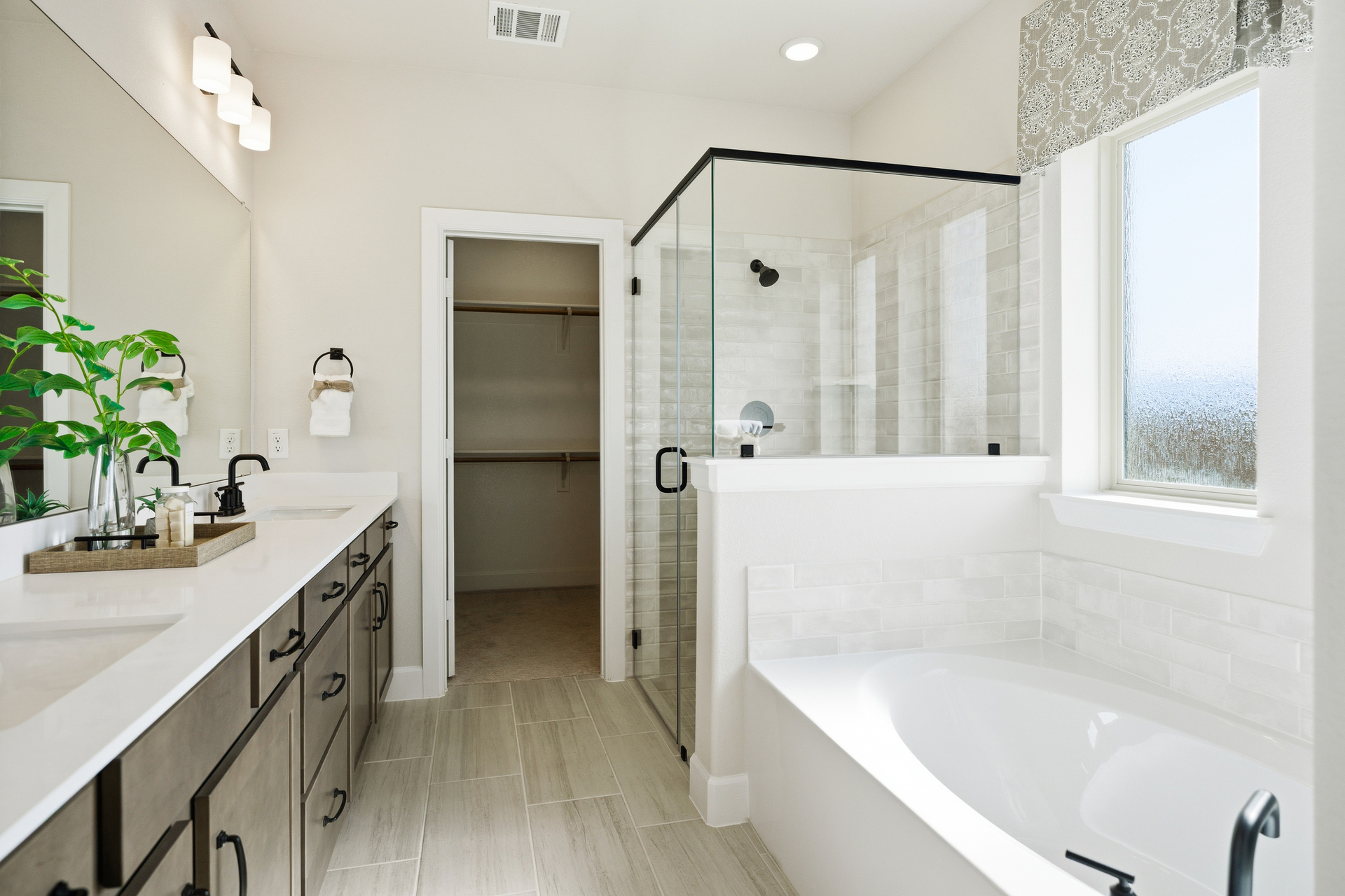 primary bathroom with soaking tub and walk-in shower