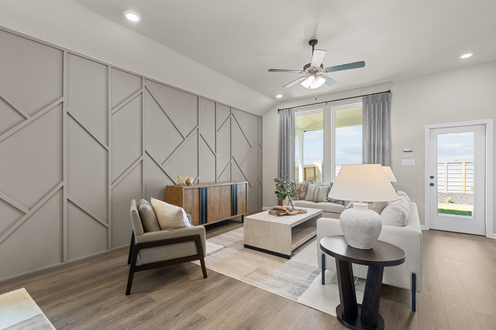 great room with couches & brown accent wall