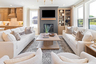 great room with wood floors, fireplace, and large windows