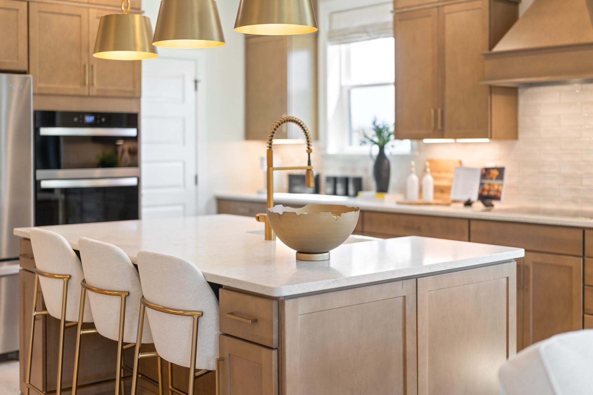 kitchen with wooden cabinets, an induction oven, and island