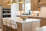 kitchen with wooden cabinets, an induction oven, and island