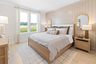 bedroom with large windows, wood floors, and an accent wall