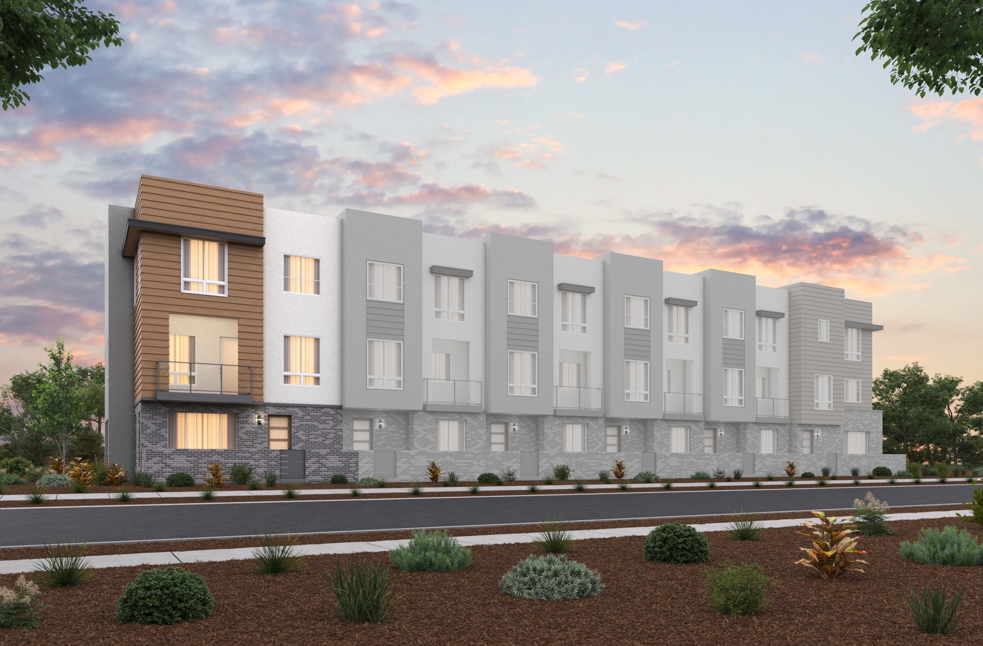 front exterior of modern brown & gray 3-story townhome building