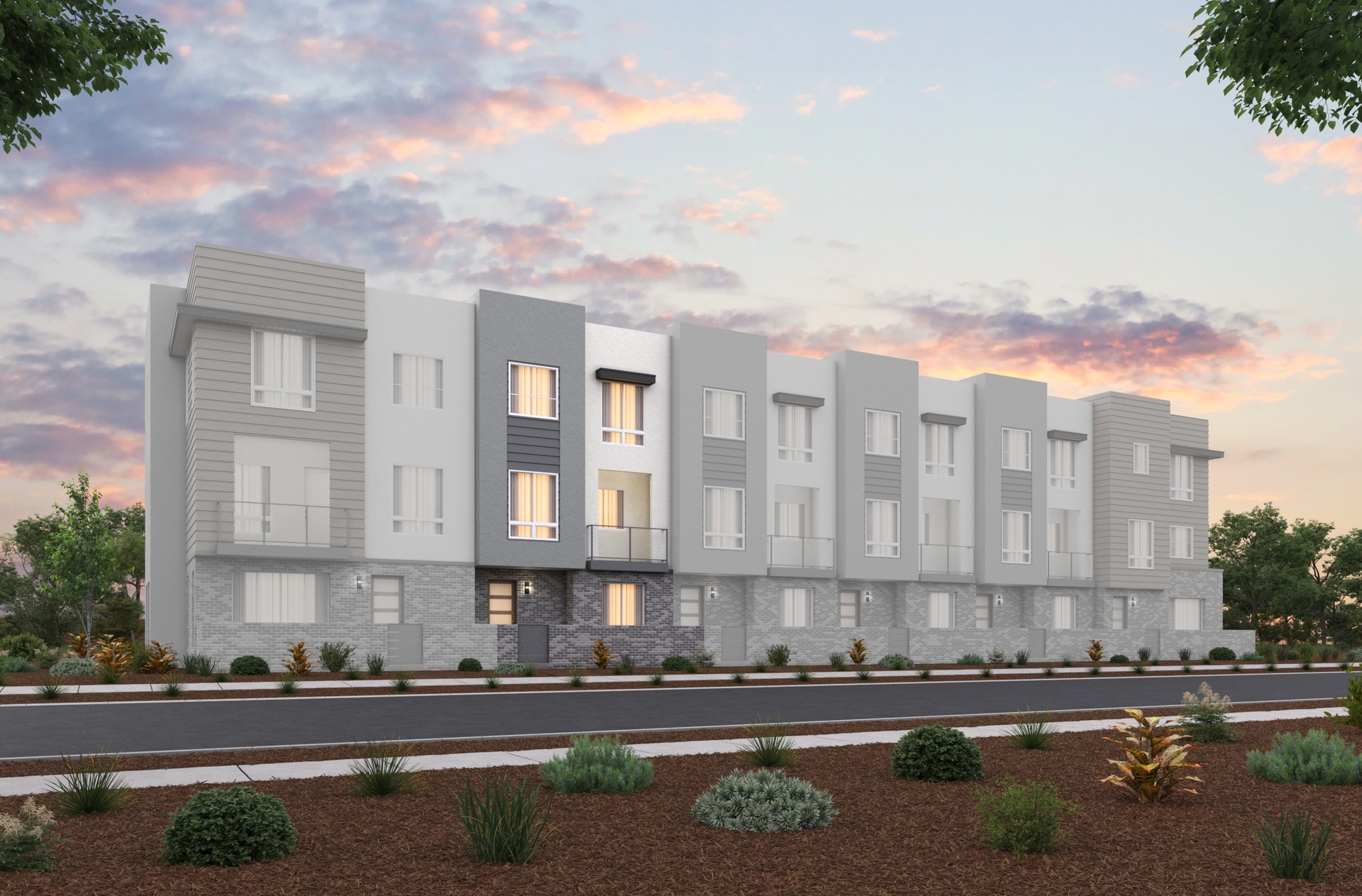 front exterior of modern gray 3-story townhome building