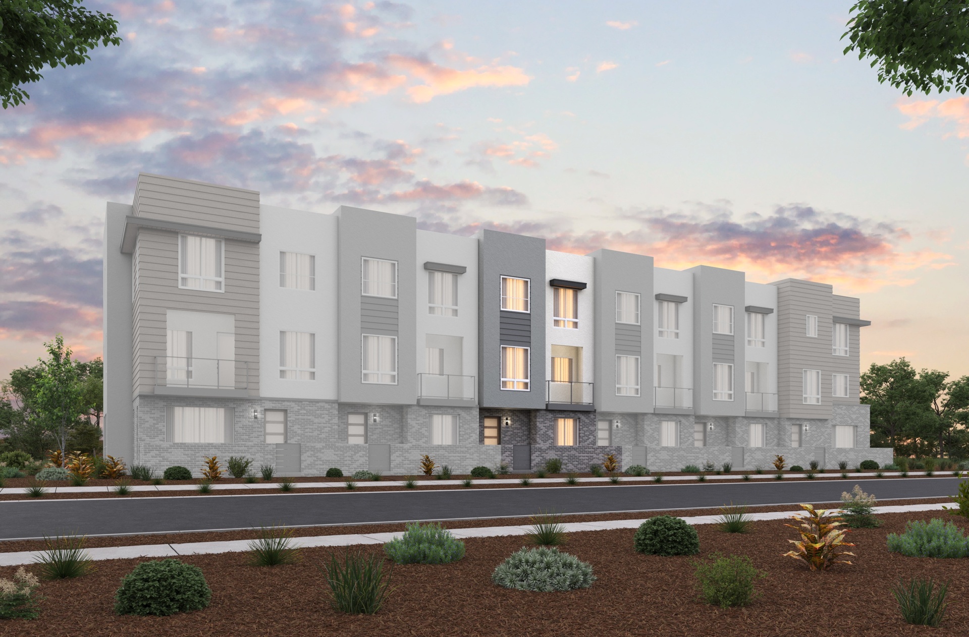 front exterior of modern gray 3-story townhome building