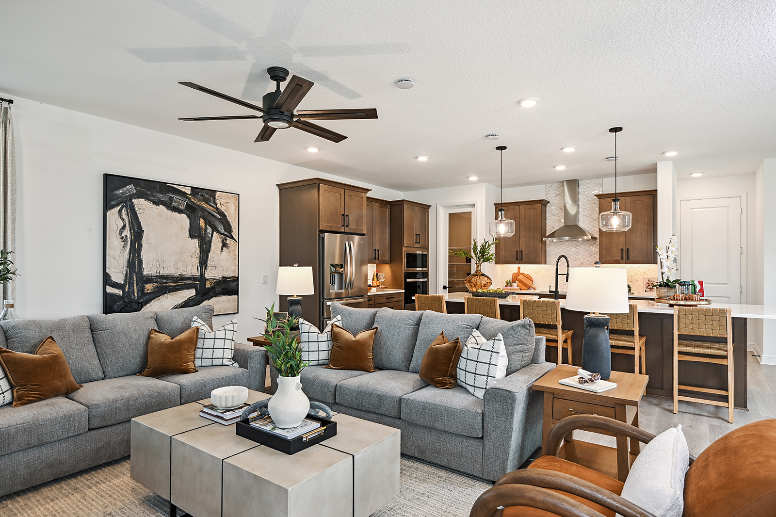 great room with two gray couches and area rug