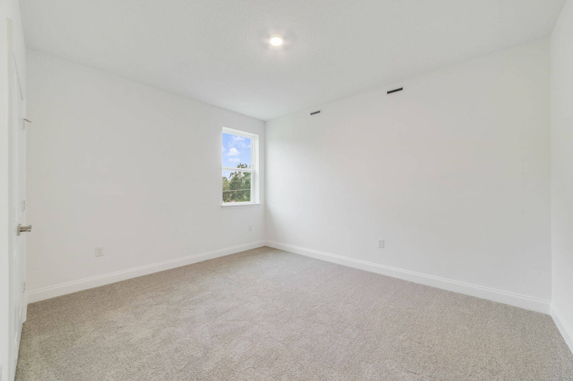 secondary bedroom with carpet and access to closet