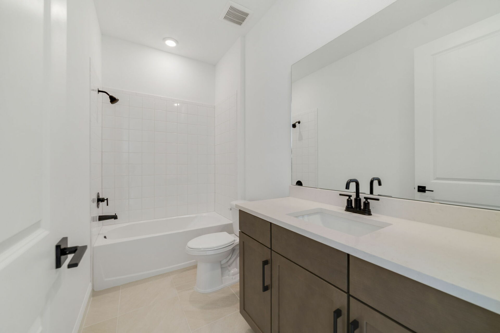 vanity with sink, mirror, and water closet 