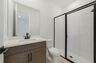 vanity with sink, mirror, and water closet 