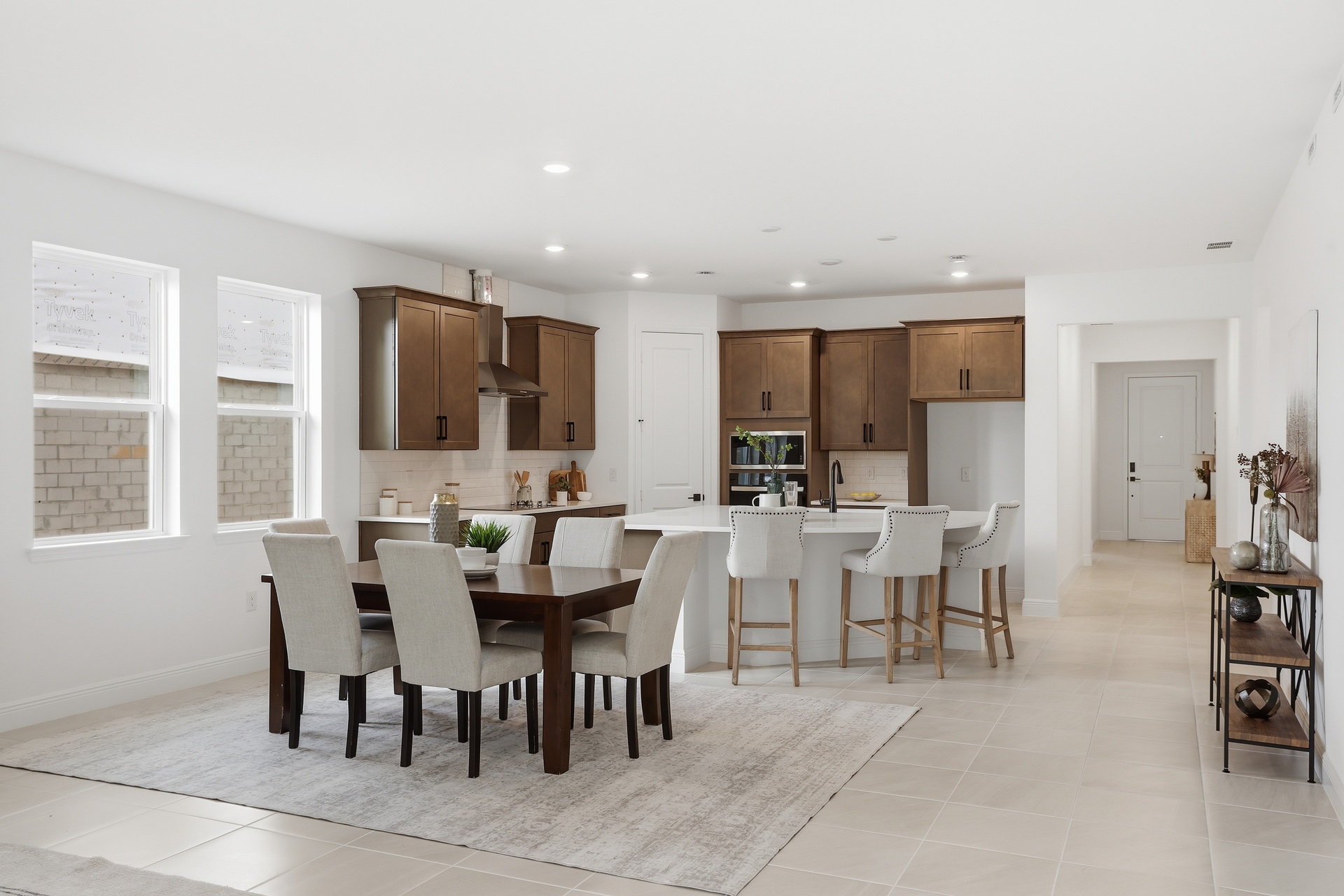 room with access to the covered lanai and view of the kitchen.