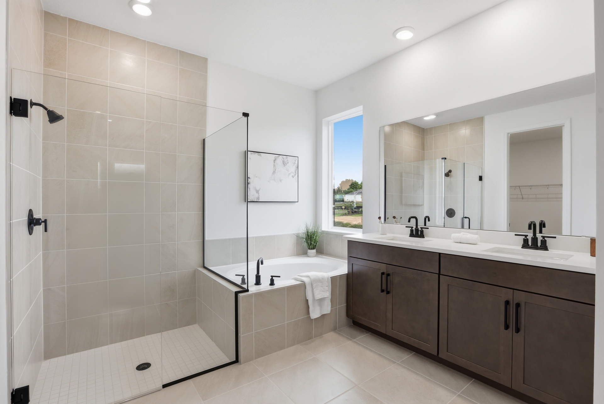 dual sink vanity with access to tub and shower