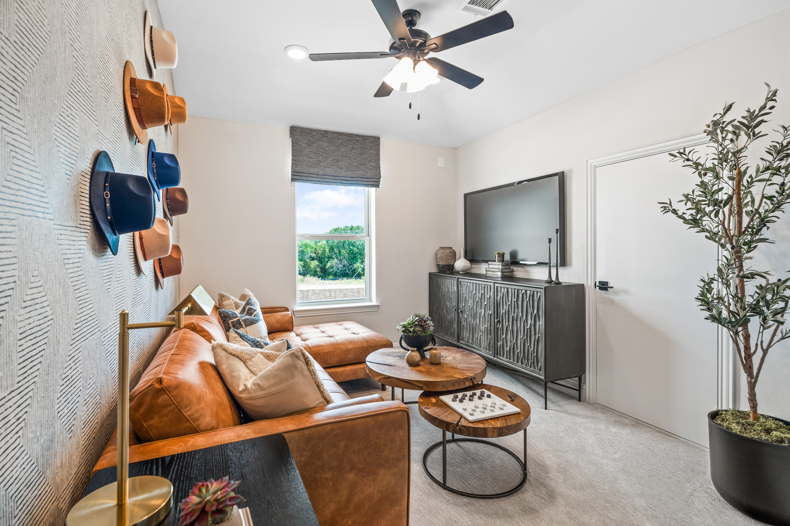 spacious loft with carpet and window