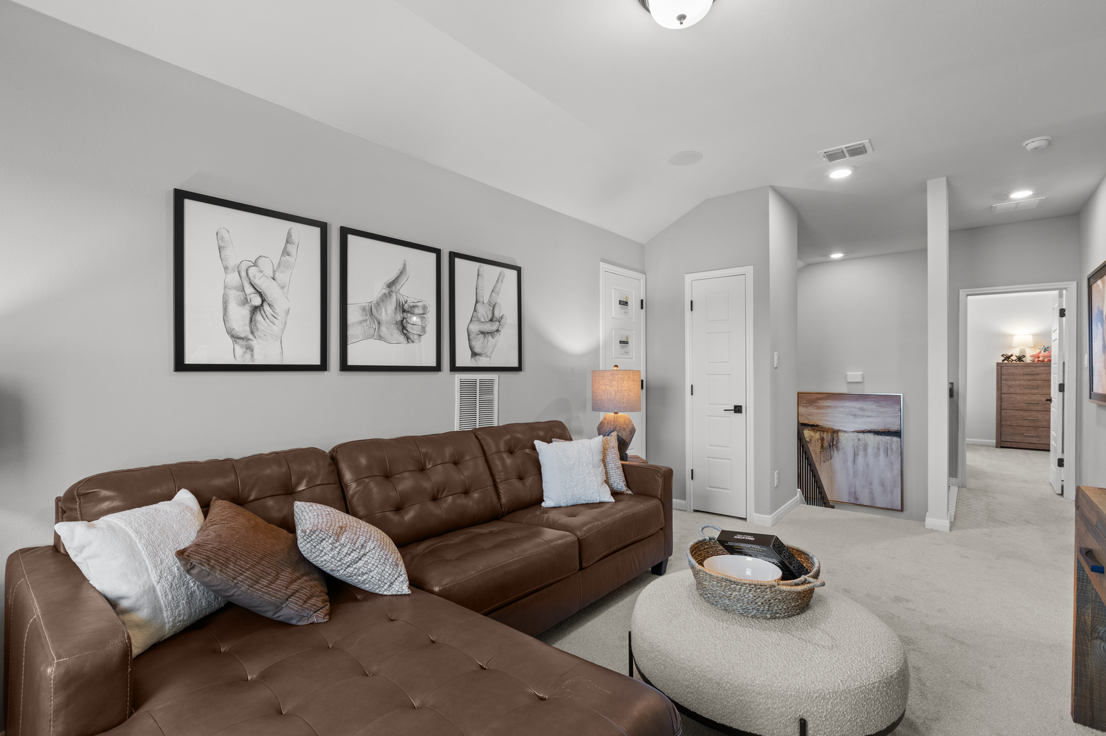 loft with brown couches, carpet & ottoman