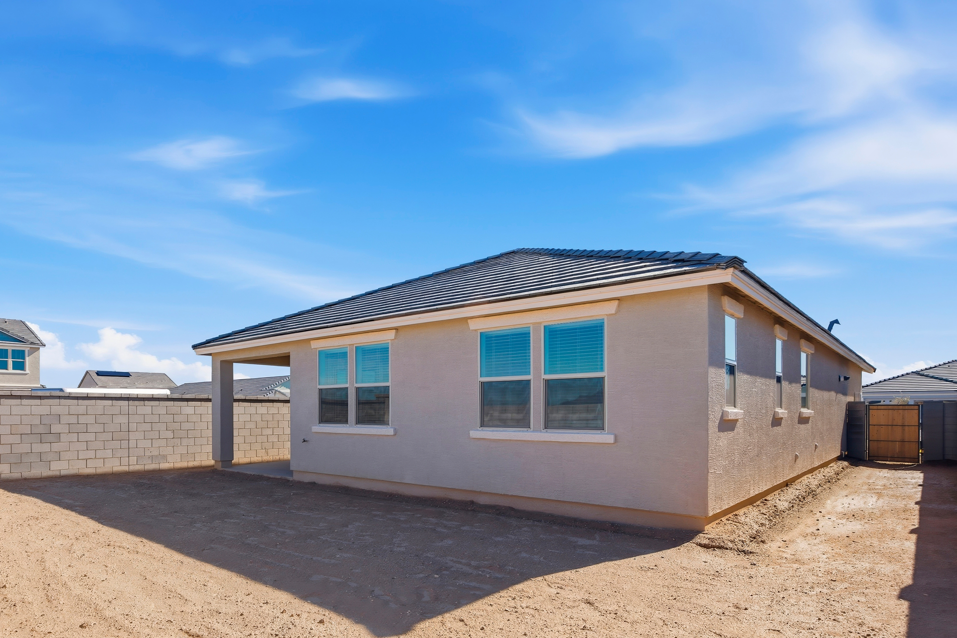 spacious backyard with concrete block wall