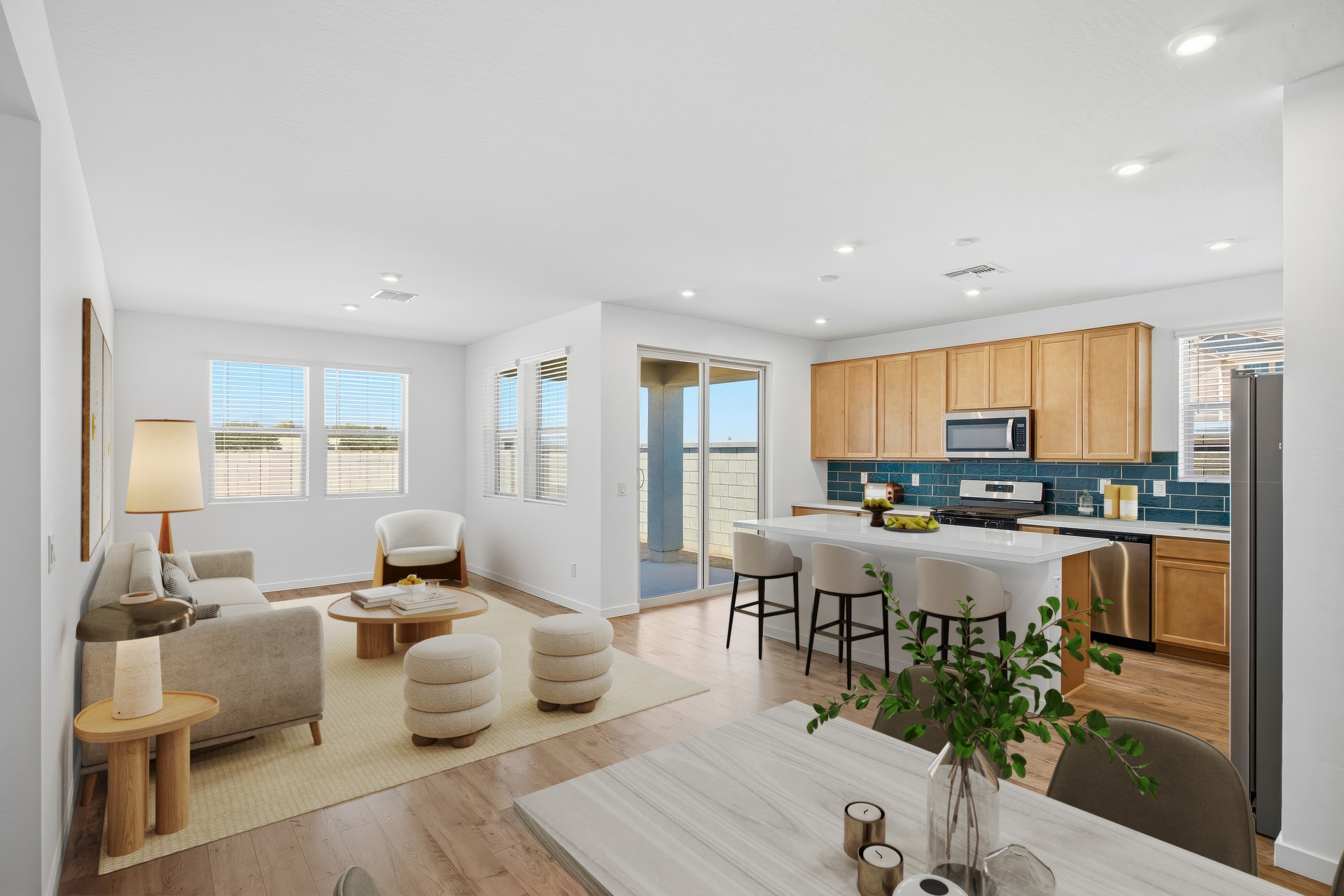 open-concept space with a large beige couch and wooden coffee table