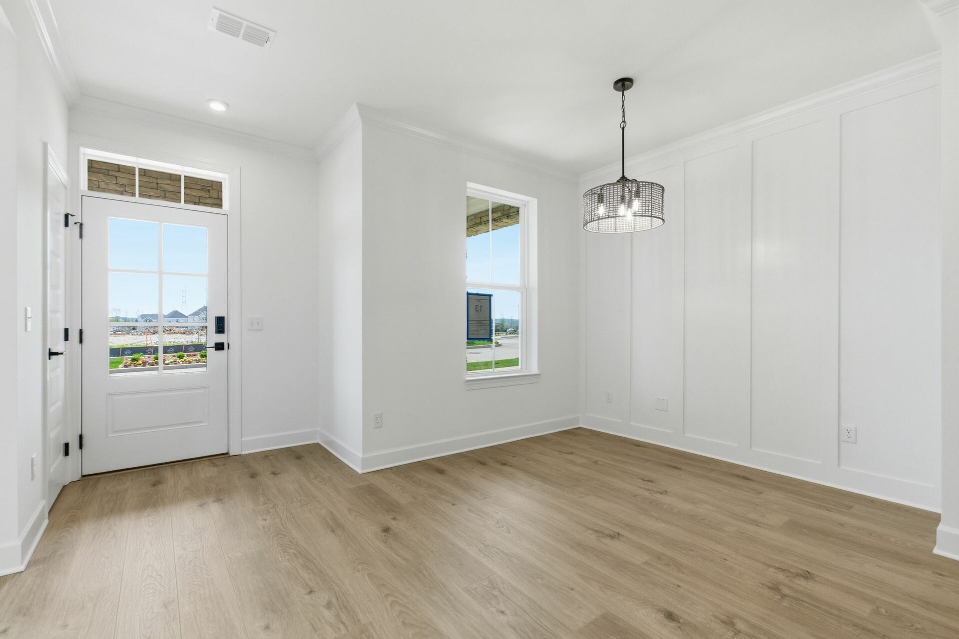 dining room with wood flooring and large windows