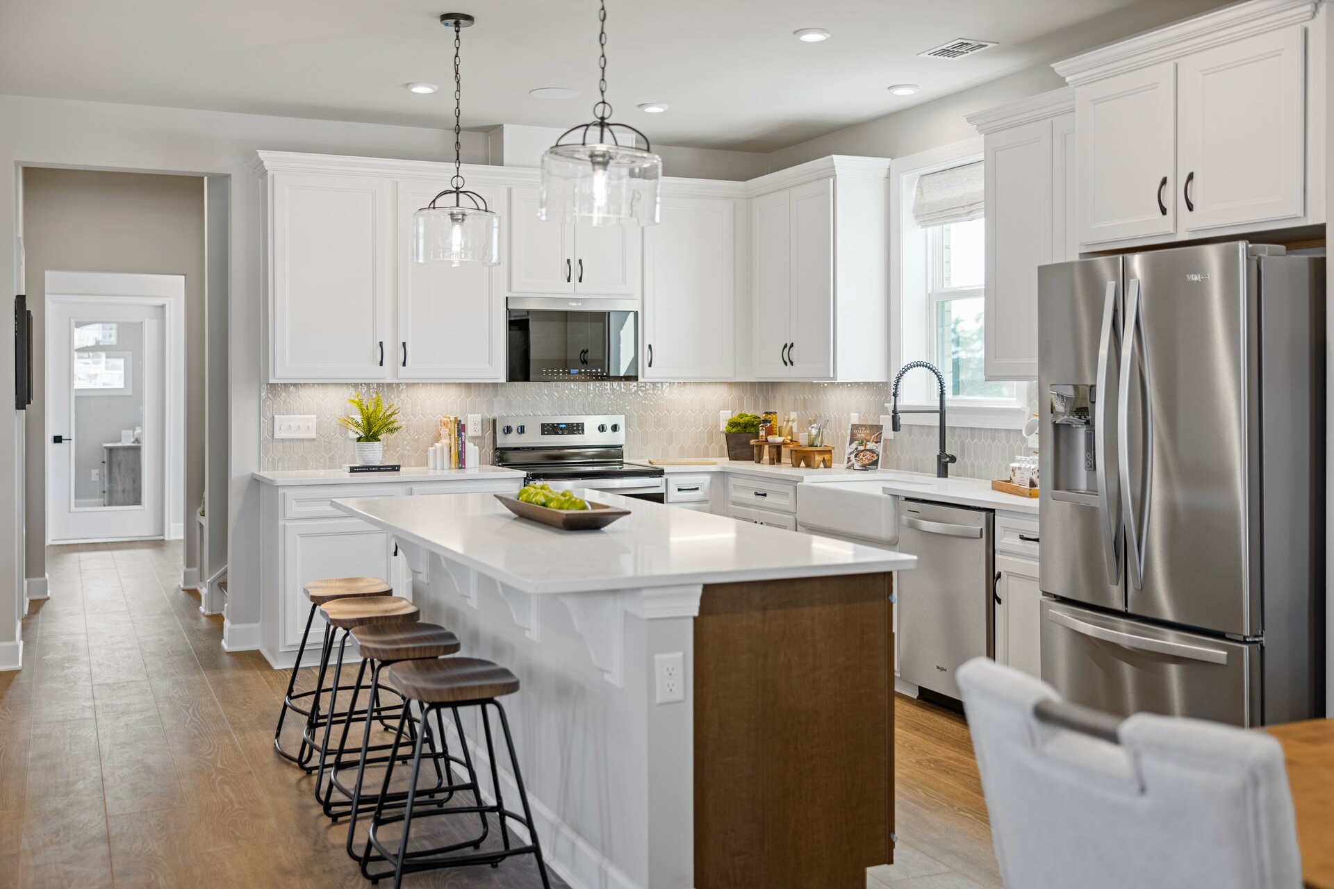 kitchen with white cabinets, white countertops, and stainless steel appliances