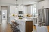 kitchen with white cabinets, white countertops, and stainless steel appliances