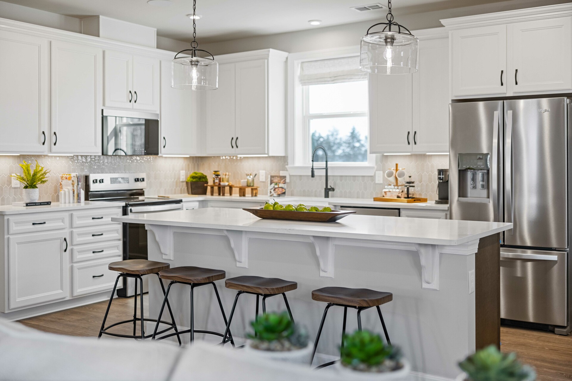 kitchen with white cabinets, white countertops, and stainless steel appliances