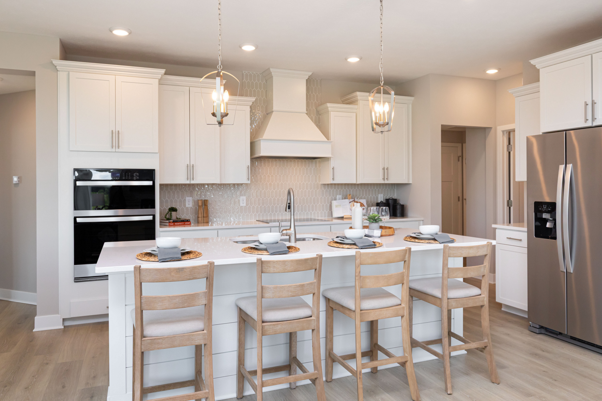 kitchen with white cabinets and hood vent