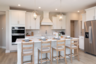 kitchen with white cabinets and hood vent